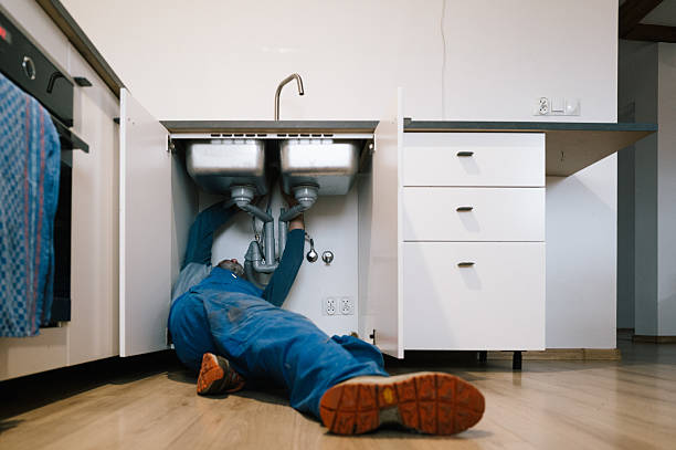 Professional Drain Cleaning technician working in Donahue, IA